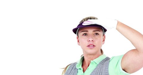 Female Golfer Looking into Distance with Determination