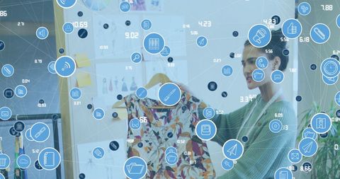 Fashion designer incorporating networked technologies into creative process
