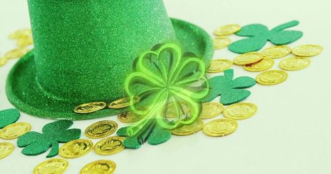 St patrick's day glitter top hat with gold coins and shamrocks on mint background