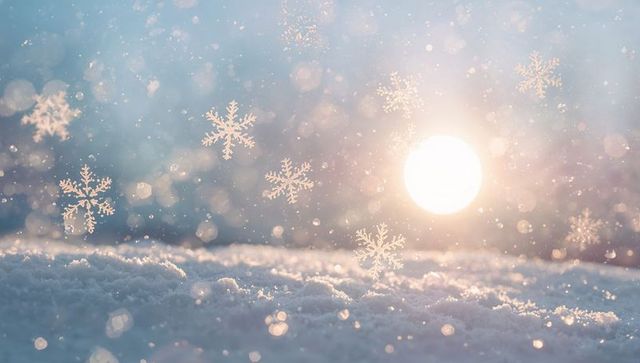 Glittering snowfield catching golden backlight with floating snowflakes and bokeh