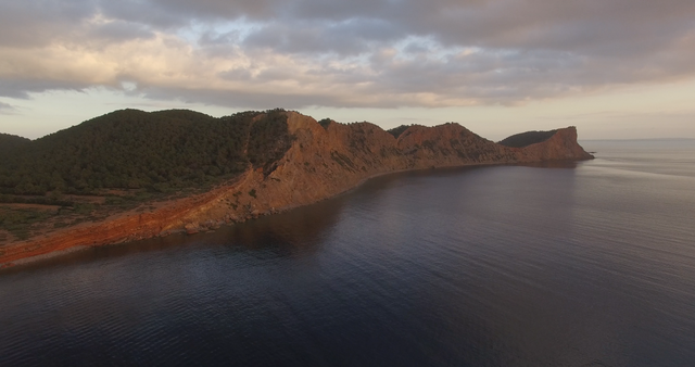 Mountain By Sea With Sunset Clouds, Transparent Water and Tranquil Ambience - Download Free Stock Videos Pikwizard.com