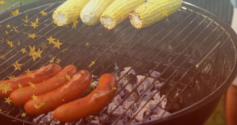 Corn and Sausages Grilling on Charcoal BBQ with Festive Stars - Download Free Stock Images Pikwizard.com
