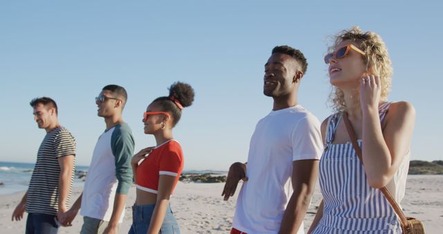 Young Multiracial Friends Walking Together on Sunny Beach - Download Free Stock Images Pikwizard.com