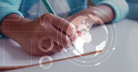 Hand writing notes with digital data overlay