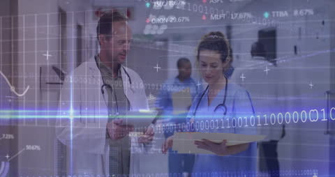 Healthcare Professionals Discussing Digital Data in Medical Setting