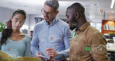 Multicultural team collaborating with augmented reality overlays reviewing business data