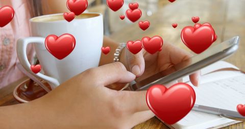 Woman texting with coffee and heart symbols