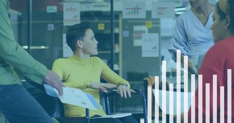 Collaborative Business Meeting with Charts in a Modern Office