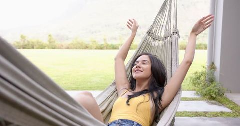 Young Woman Relaxing in Hammock Outdoors - Download Free Stock Images Pikwizard.com