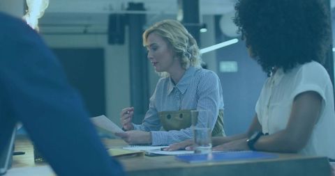 Dynamic Businesswomen Collaborating in Modern Office