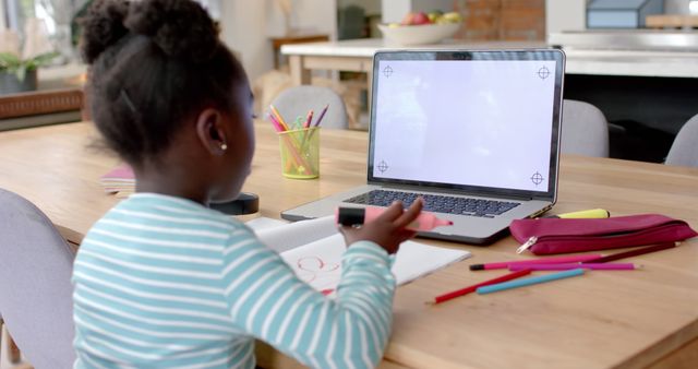 African American girl studying with laptop at home - Download Free Stock Images Pikwizard.com