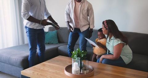 Family bonding on cozy sofa reading together indoors