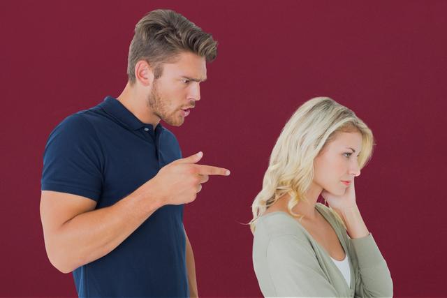 Digital composite of Displeased couple against maroon background