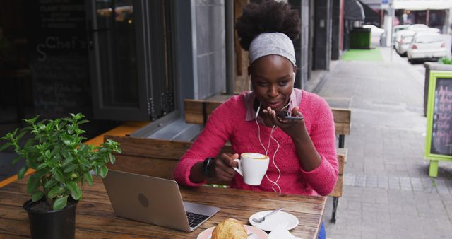 Woman Enjoying Coffee while Talking on Phone Outdoors in Urban Setting - Download Free Stock Images Pikwizard.com