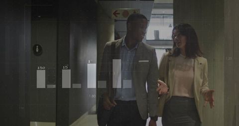 Corporate colleagues walking through office with data overlay