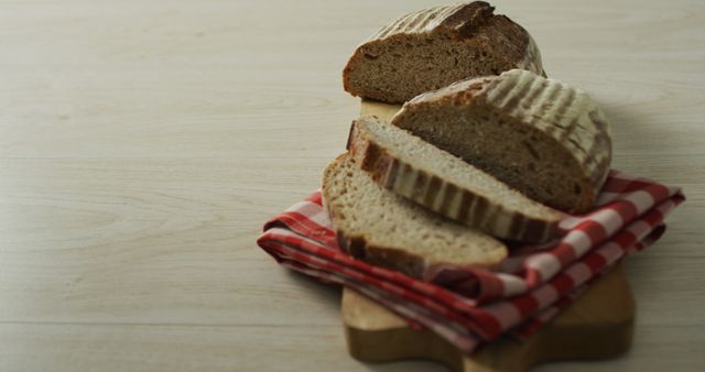 Image of bread on chopping board on a wooden surface. food, cuisine and catering ingredients.