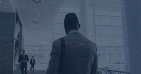 Businessman Overlooking Digital Cityscape Data Overlay