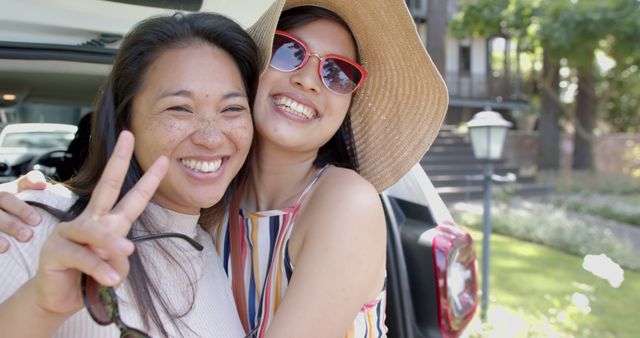 Joyful Friends Hugging During Summer Road Trip in Daylight - Download Free Stock Images Pikwizard.com