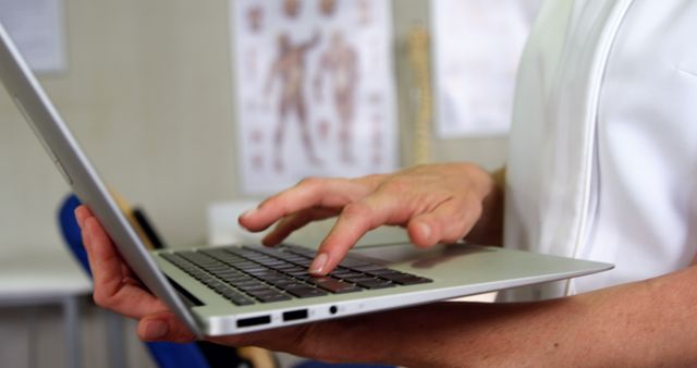 Female physiotherapist using laptop in clinic 4k - Download Free Stock Photos Pikwizard.com
