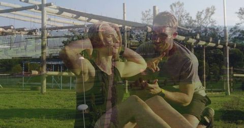 Outdoor situp exercise with coach guidance in park