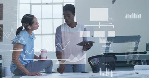 Diverse Colleagues Discussing Financial Data with Technology Graphics