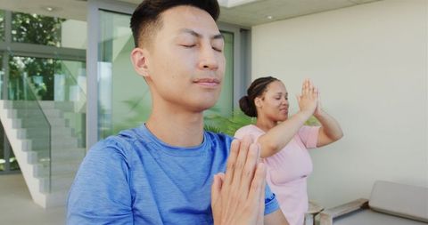 Diverse Young Adults Practicing Yoga Outdoors in Tranquil Space