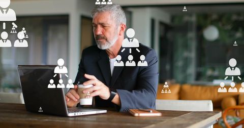 Senior businessman utilizing digital communication technology