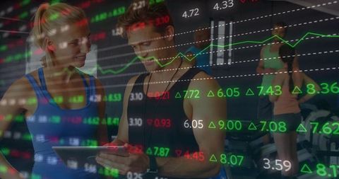 Personal Trainer Analyzing Client Performance with Market Data Overlay