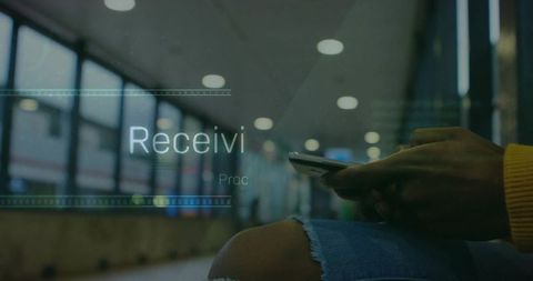 Person Using Smartphone in Modern Airport Terminal