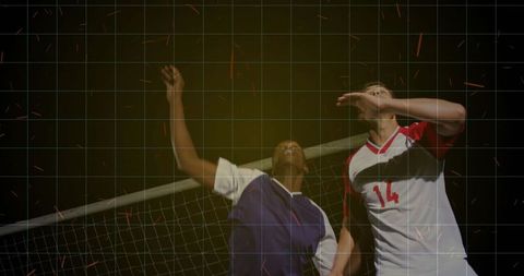 Intense Volleyball Duel with Sparks Illuminating Dynamic Jump