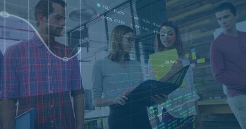 Team Analyzing Financial Data on Laptop in Modern Office