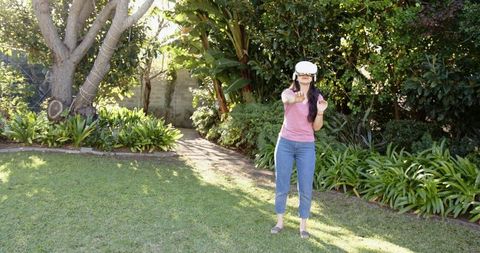 VR Technology in Outdoor Relaxation with Asian Woman