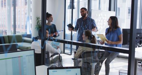 Diverse Team Collaborating in Modern Office with Digital Interfaces