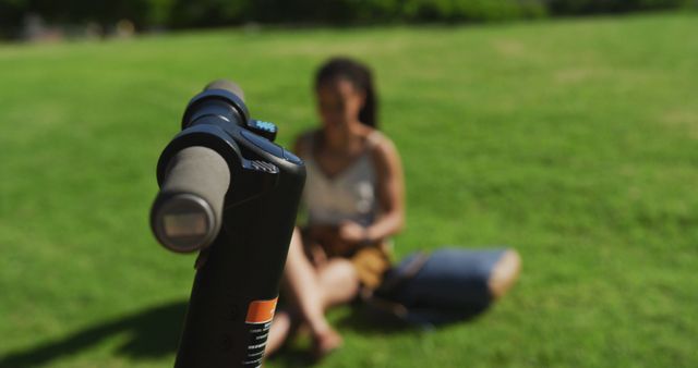 Electric Scooter Handlebar Focus with Woman Relaxing on Grass - Download Free Stock Images Pikwizard.com