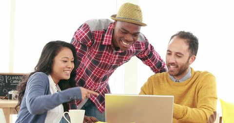Diverse Team Enjoying Collaborative Work in Modern Office