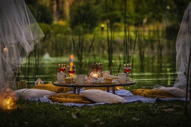 Romantic Outdoor Picnic Setting by Lake at Dusk - Download Free Stock Photos Pikwizard.com
