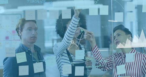 Diverse Team Brainstorming Digital Interface in an Office Background