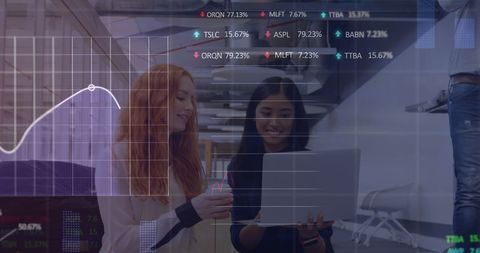 Diverse Women Analyzing Stock Data at Office