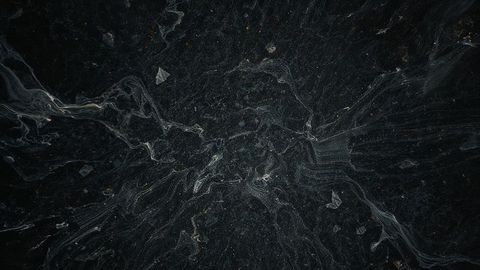 Mystical filamentous foam patterns on dark water surface