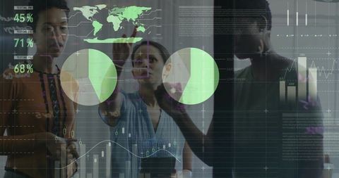 Business team analyzing data on interactive glass screen