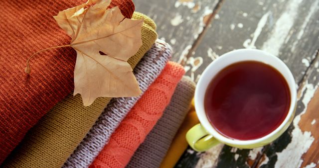 Warm Blanket with Autumn Leaves and Hot Tea on Rustic Wooden Table - Download Free Stock Images Pikwizard.com