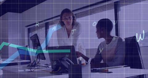 Diverse women collaborating in tech-driven office environment