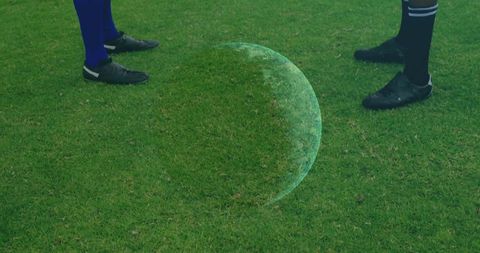 Futuristic soccer concept with holographic orb on green field
