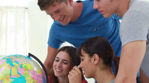 Group of Happy Friends Exploring World Globe