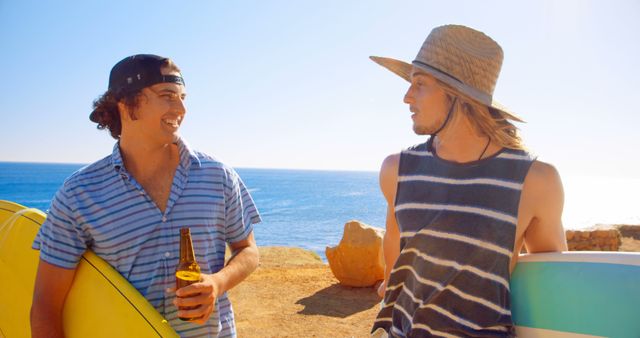 Friends Talking Beachside Holding Surfboards and Beer on Sunny Day - Download Free Stock Images Pikwizard.com