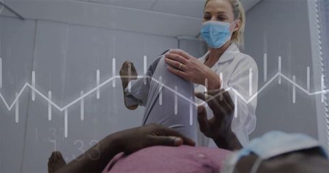 Clinician assisting senior patient during knee exam with ecg waveform overlay