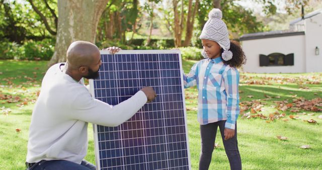 Father and Daughter Learning About Solar Panel Installation - Download Free Stock Images Pikwizard.com