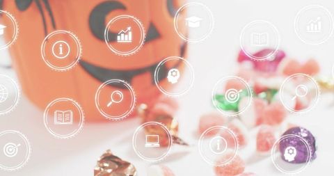 Smiling jack-o'-lantern candy bucket with pastel sweets and circular ui icons