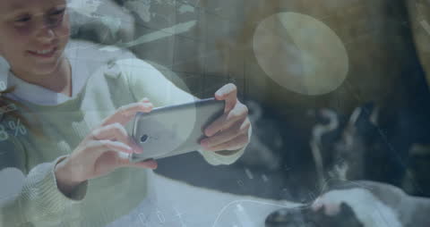 Businesswoman Using Smartphone with Global Data Overlay