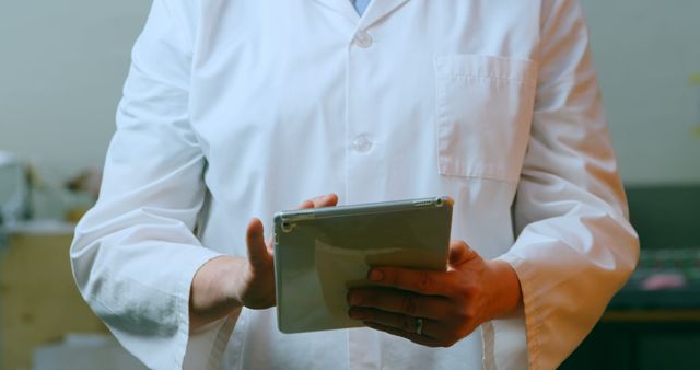 Medical Professional Using Digital Tablet in Lab Coat - Download Free Stock Images Pikwizard.com